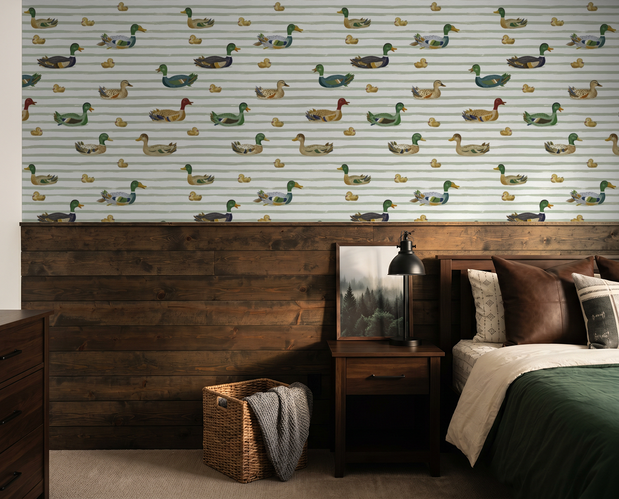 Duck pattern wallpaper with green, brown, cream tones in rustic bedroom.