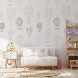 "Ellie Wallpaper by Wall Blush in a cozy living room, featuring elegant hot air balloon designs as the focal point."