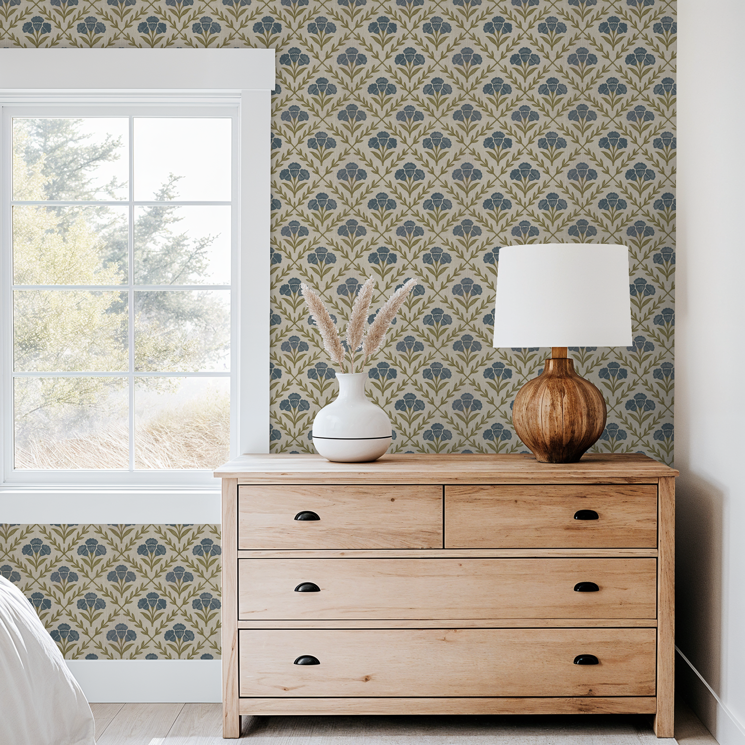 Floral wallpaper with blue and olive pattern in cozy bedroom setting.