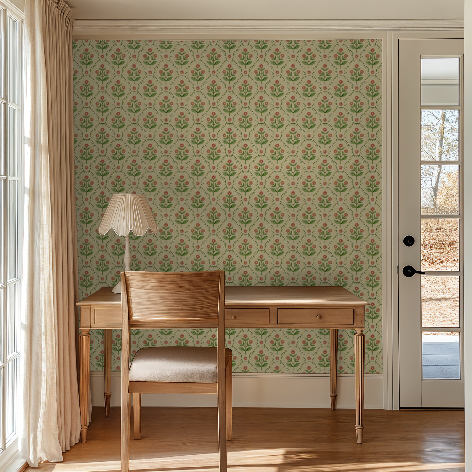 Floral wallpaper with coral and green motifs in a cozy study room with wooden desk and chair.