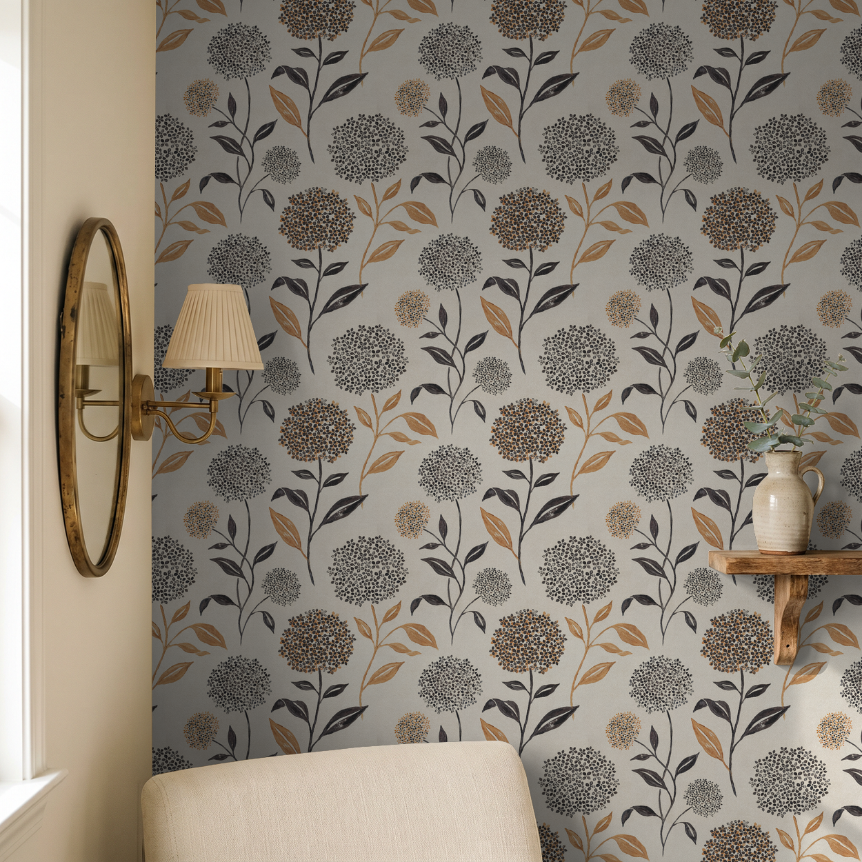 Floral wallpaper with terracotta and charcoal blooms on ivory backdrop in cozy living room.