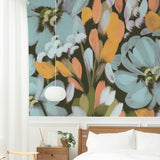 "Wall Blush's Lily Wallpaper adds a vibrant touch to a modern bedroom, highlighting stylish home decor."