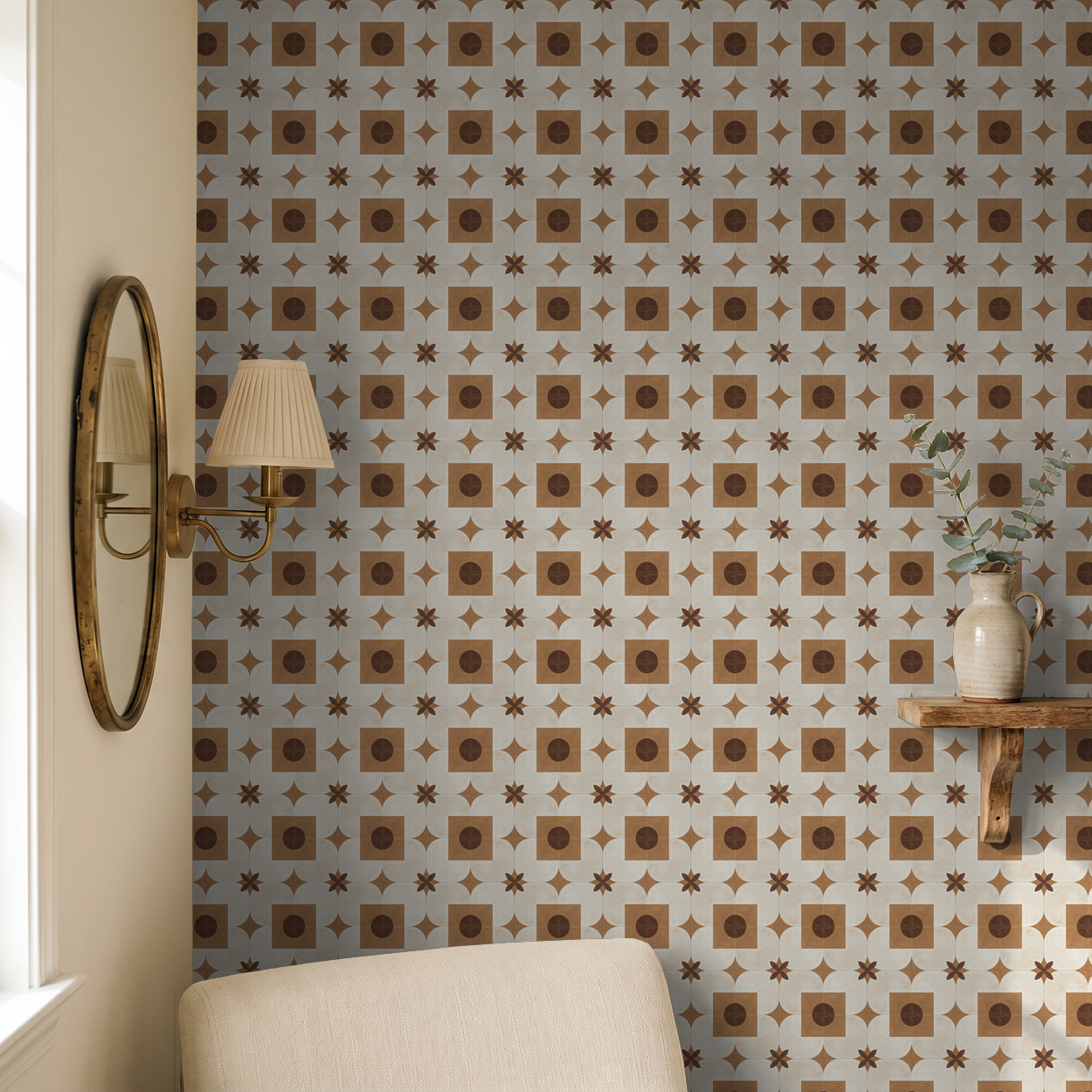 Geometric terracotta and cream wallpaper in cozy room with mirror and shelf decor.