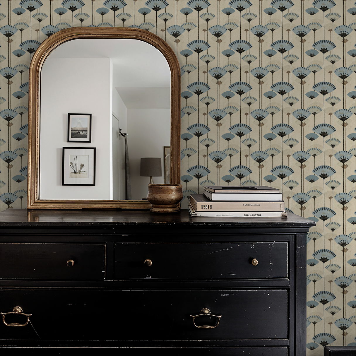 Gilded Petals wallpaper with blue and charcoal floral pattern in elegant room with mirror.