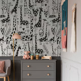 "Wall Blush's Love You Long Time Wallpaper in a cozy nursery, highlighted as the playful focal point."