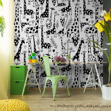 "Wall Blush 'Love You Long Time Wallpaper' in a playful children's room, with animal patterns as the focal point."