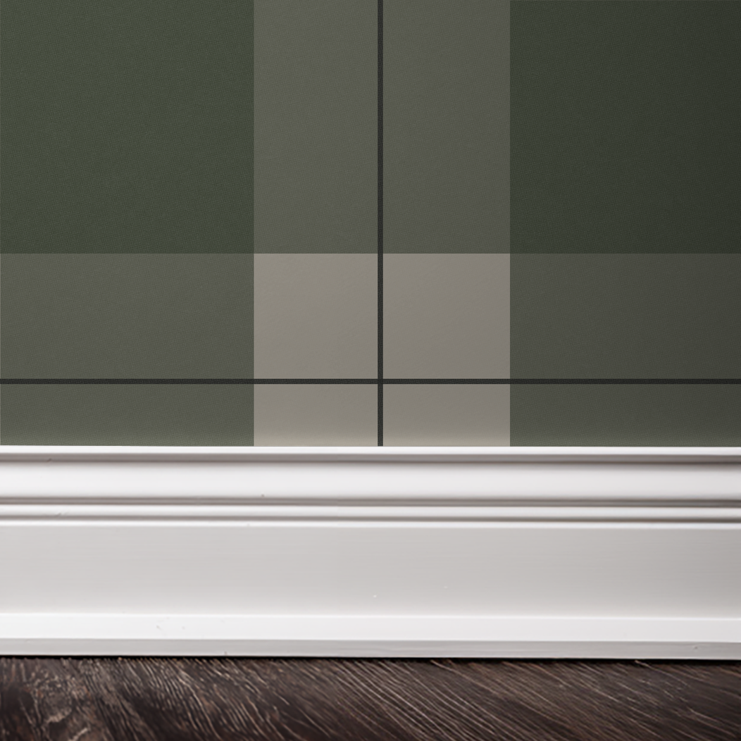 Green and cream plaid wallpaper with white baseboard and dark wood floor