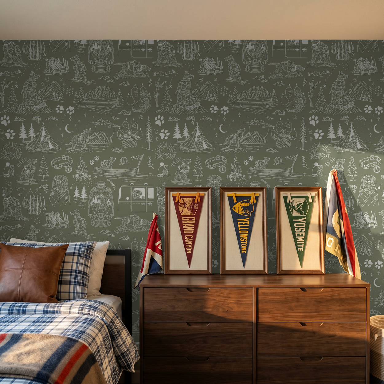Green dog-themed wallpaper with camping sketches in a cozy bedroom setting.