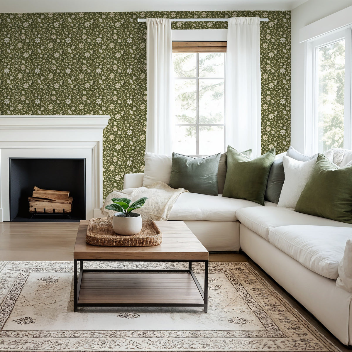 Green floral wallpaper with cream flowers in cozy living room with white sofa and fireplace.