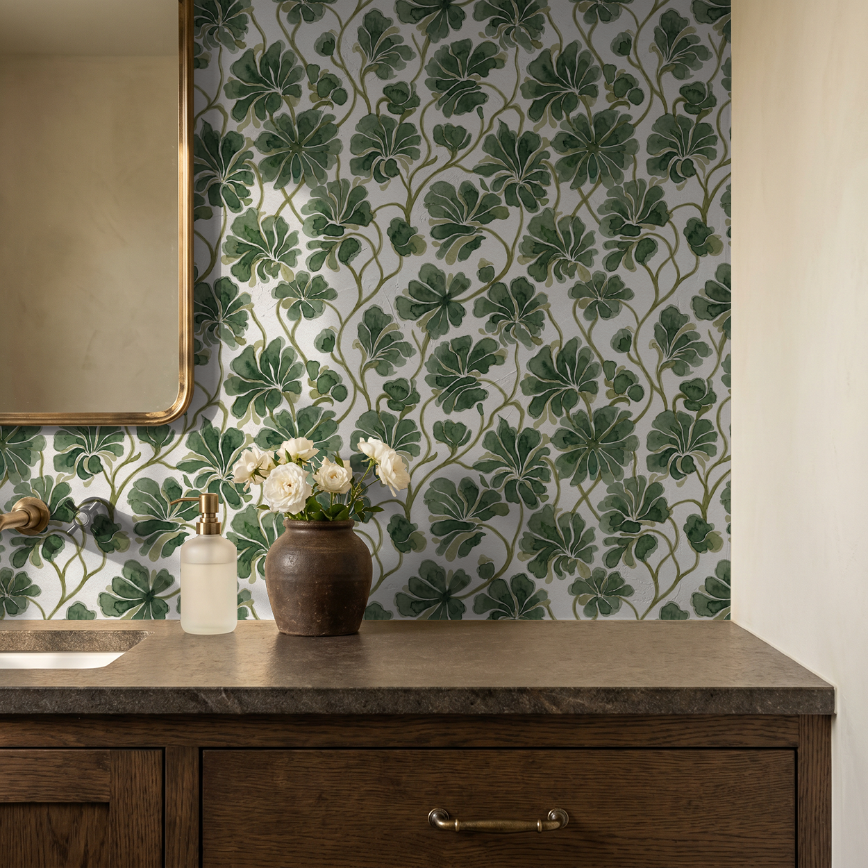Green foliage wallpaper with watercolor effect in elegant bathroom setting.