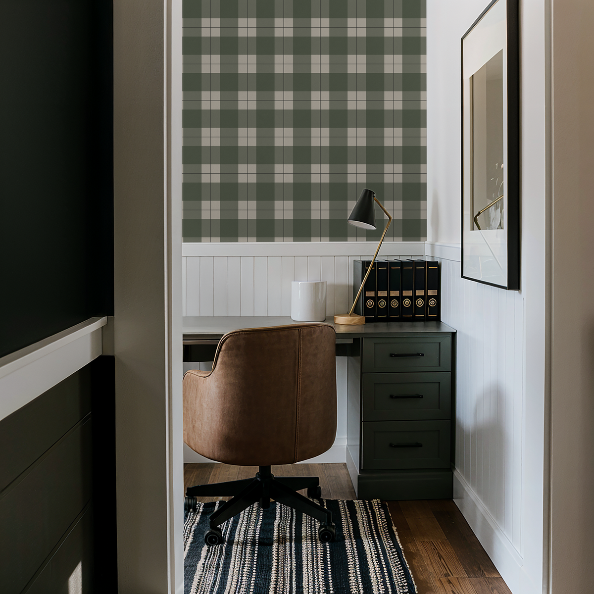 Green plaid wallpaper in cozy study with modern desk and chair.