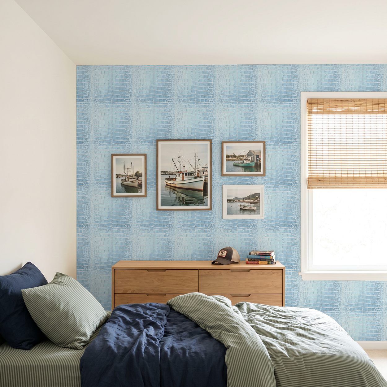 Icy blue reptile-pattern wallpaper in modern bedroom with framed art.