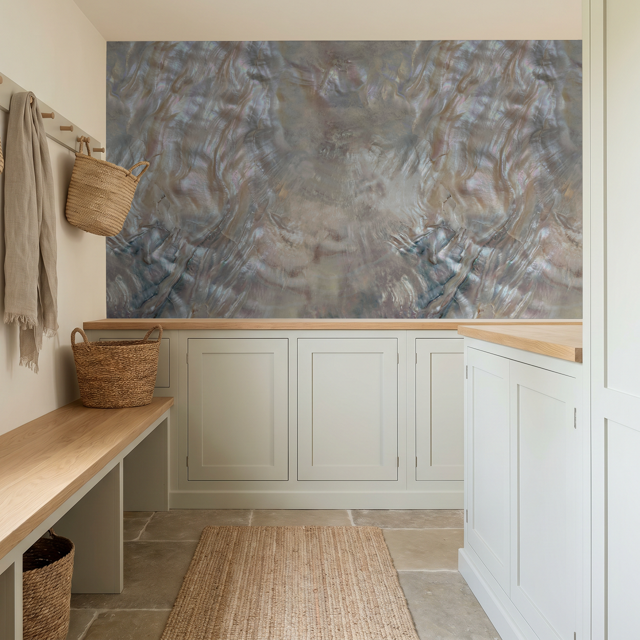 Iridescent textured wallpaper in neutral mudroom with baskets and bench.