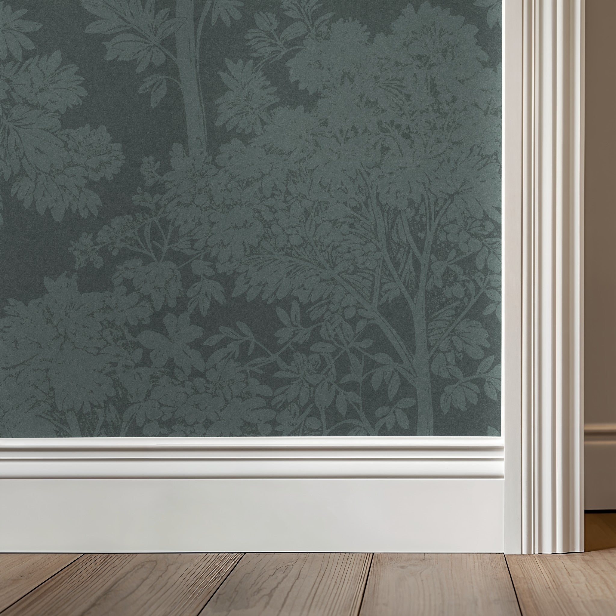 Light teal botanical wallpaper with tree silhouettes in a modern room setting.