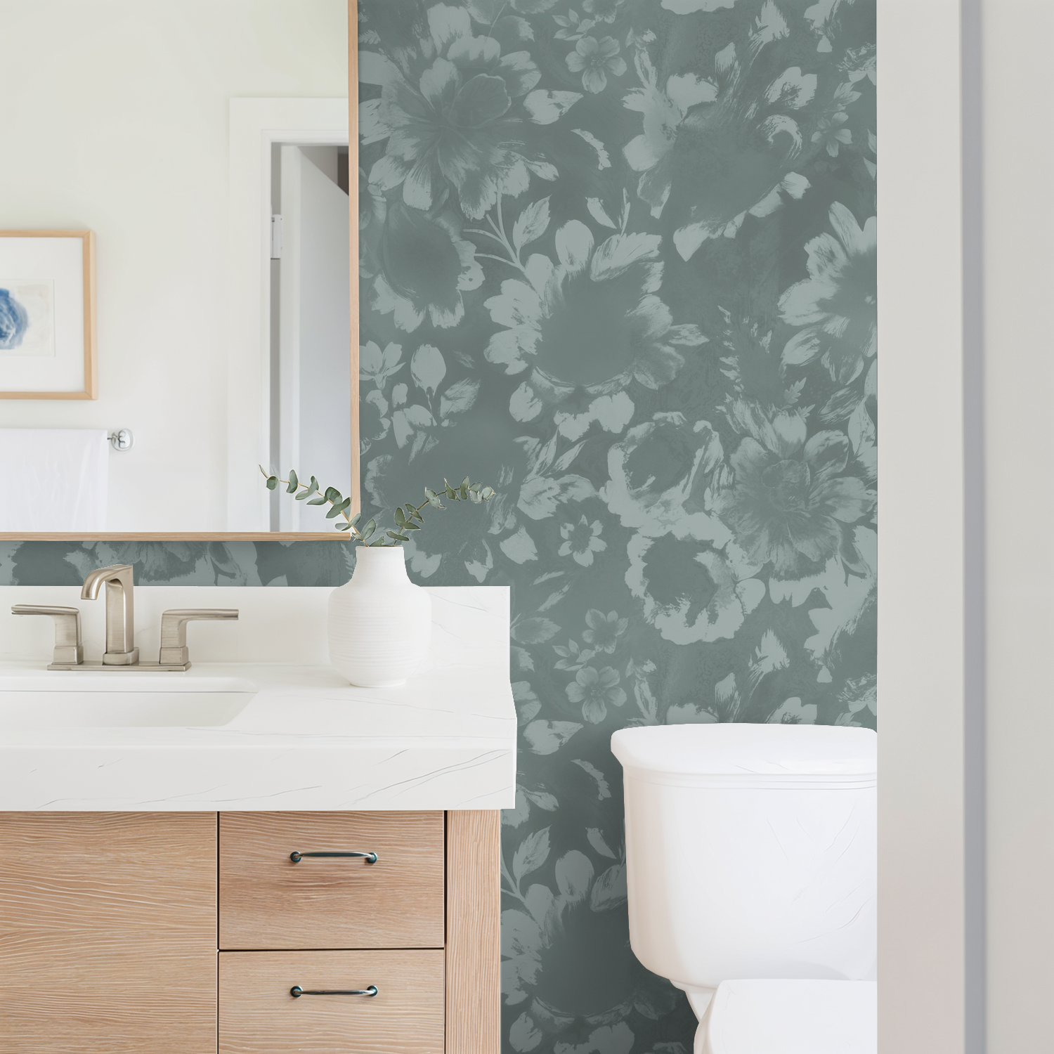 Light teal floral wallpaper in a modern bathroom with wooden vanity and white decor.