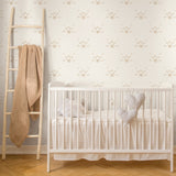 "Wall Blush's Whiskers Wallpaper prominently featured in modern nursery setting with a stylish crib."