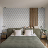 "Stylish bedroom featuring Wall Blush's Love Triangle Wallpaper, creating a modern aesthetic focus."