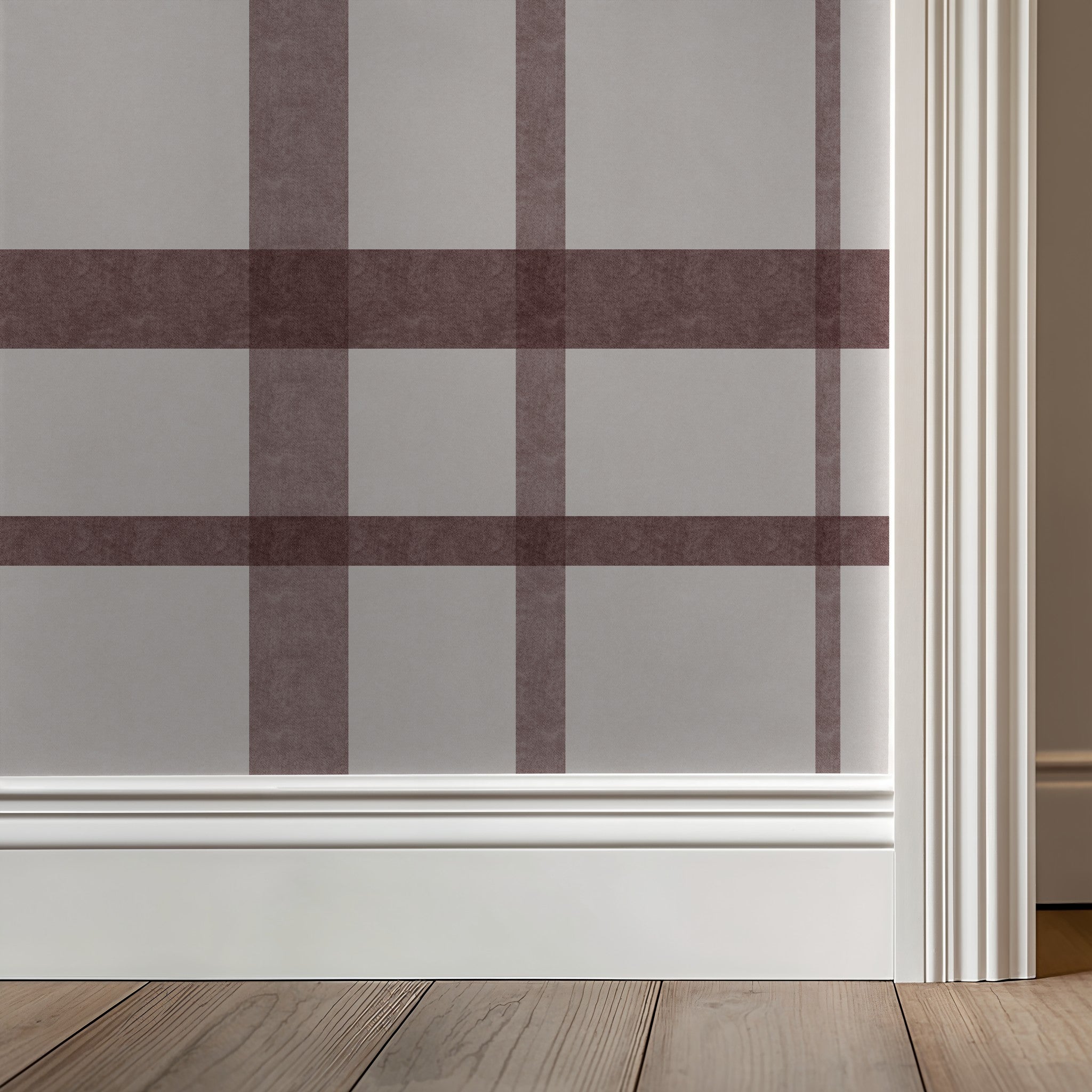 Maroon plaid wallpaper with white trim in a cozy room setting