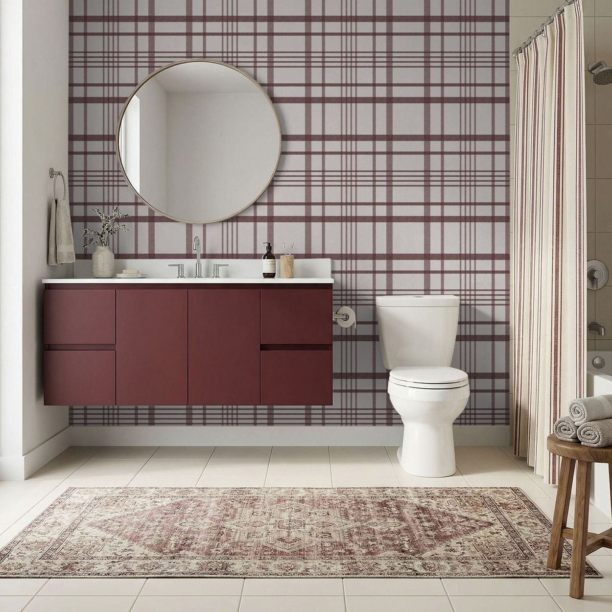 Maroon plaid wallpaper in modern bathroom with round mirror and maroon vanity.