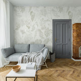"Leaf Me Be Wallpaper by Wall Blush in a stylish living room with botanical print focusing on the elegant wall decor."