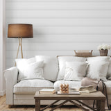 "Anniston Wallpaper by Wall Blush in a stylish living room setting, showcasing elegant white couch and decor accents."
