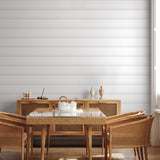 "Wall Blush Anniston Wallpaper showcased in a modern dining room, featuring elegant light-striped design."