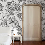 "Wall Blush's Midnight Flower Wallpaper featured in a cozy bedroom, highlighting elegant floral designs."