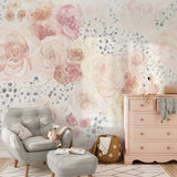 "Wall Blush's Pastel Posey Wallpaper featured in a cozy nursery room with stylish decor accents."