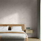 "Wall Blush Sweet Cream Wallpaper in a stylish modern bedroom, herringbone pattern focus"