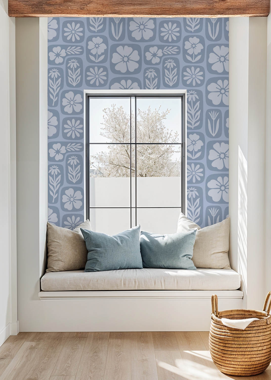 Mono blue floral wallpaper in cozy window nook with cushions