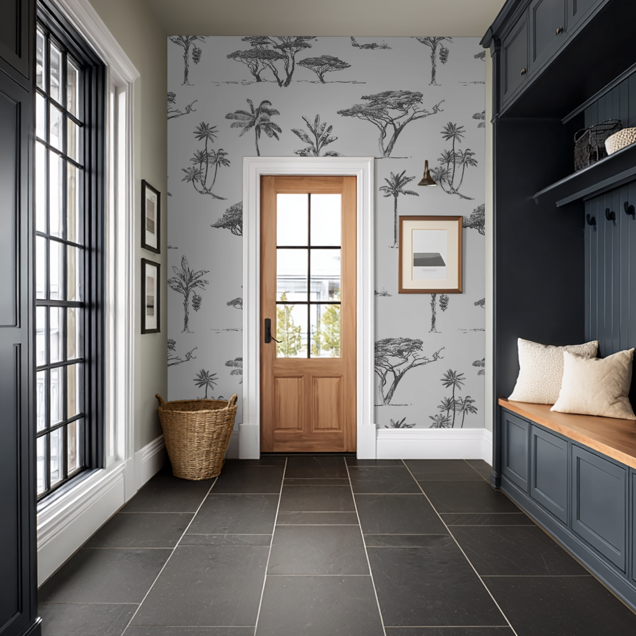 Monochrome botanical tree wallpaper in elegant entryway with bench and cushions.