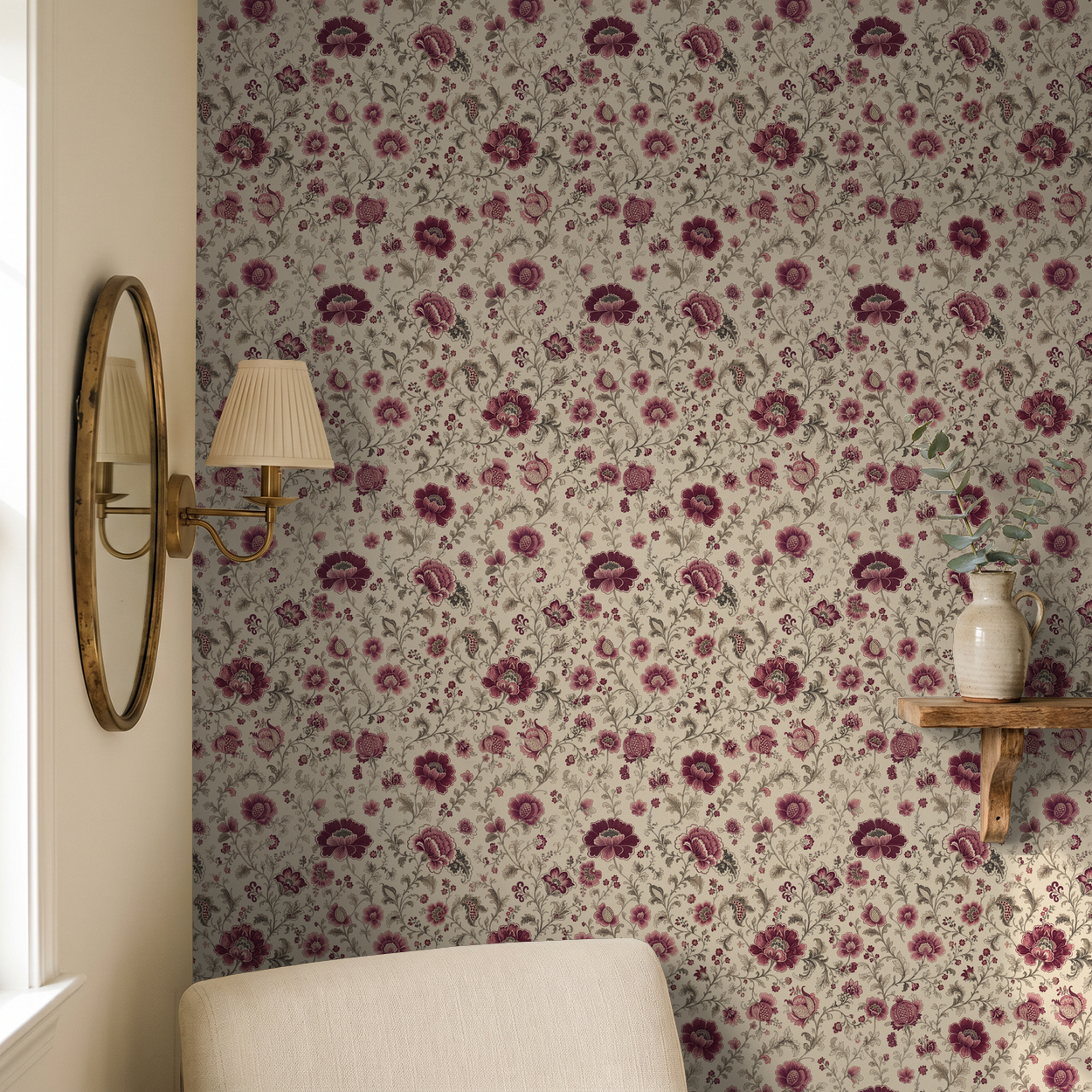 Mulberry chintz floral wallpaper with maroon flowers in cozy vintage room.