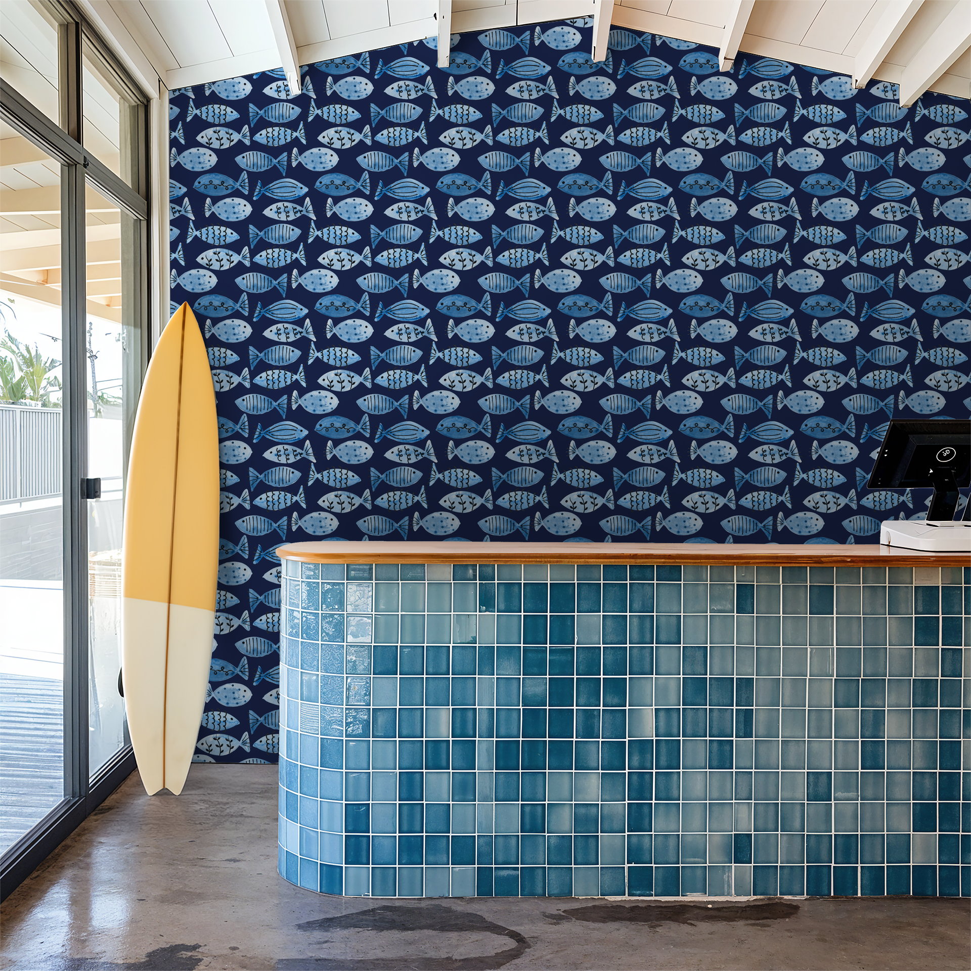 Navy wallpaper with whimsical blue fish pattern in a coastal-themed room.