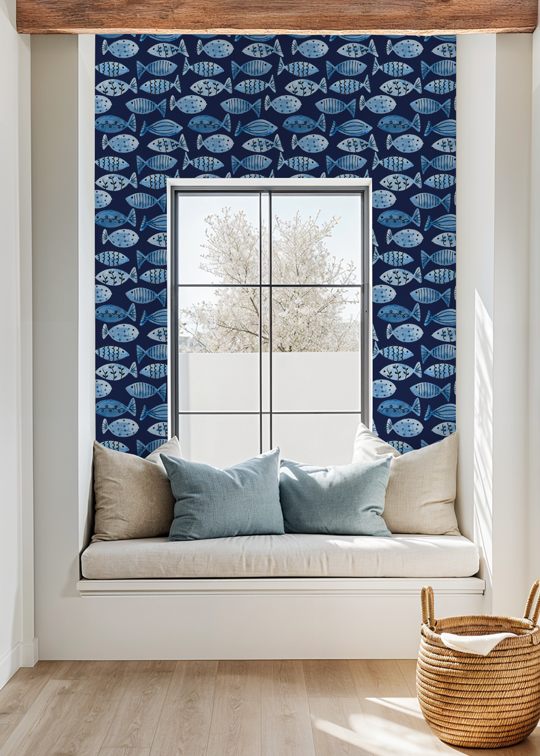 Navy blue fish pattern wallpaper in a cozy window nook with cushions.