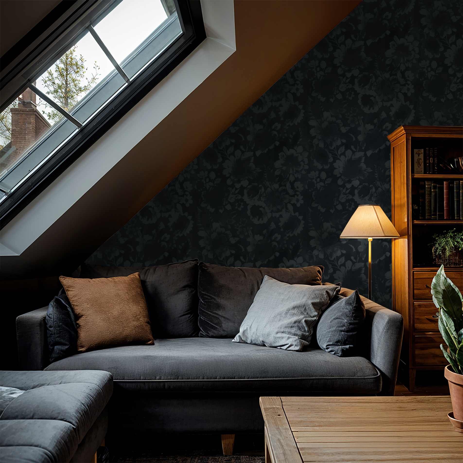 Navy floral wallpaper with shadowy blooms in cozy living room with gray sofa and lamp.