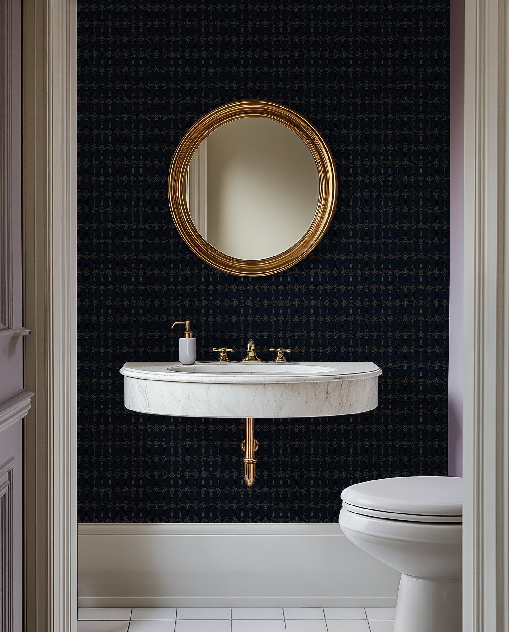Navy and gold geometric wallpaper in elegant bathroom with round mirror