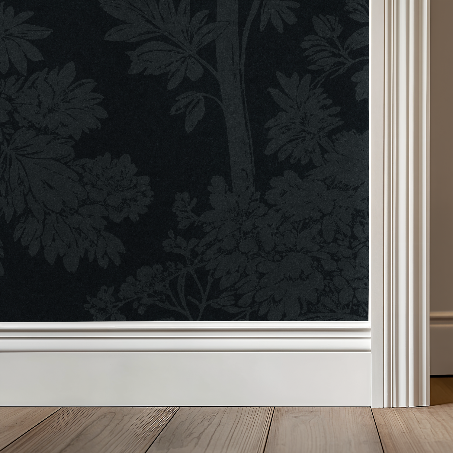 Navy wallpaper with tree silhouettes in elegant room setting.