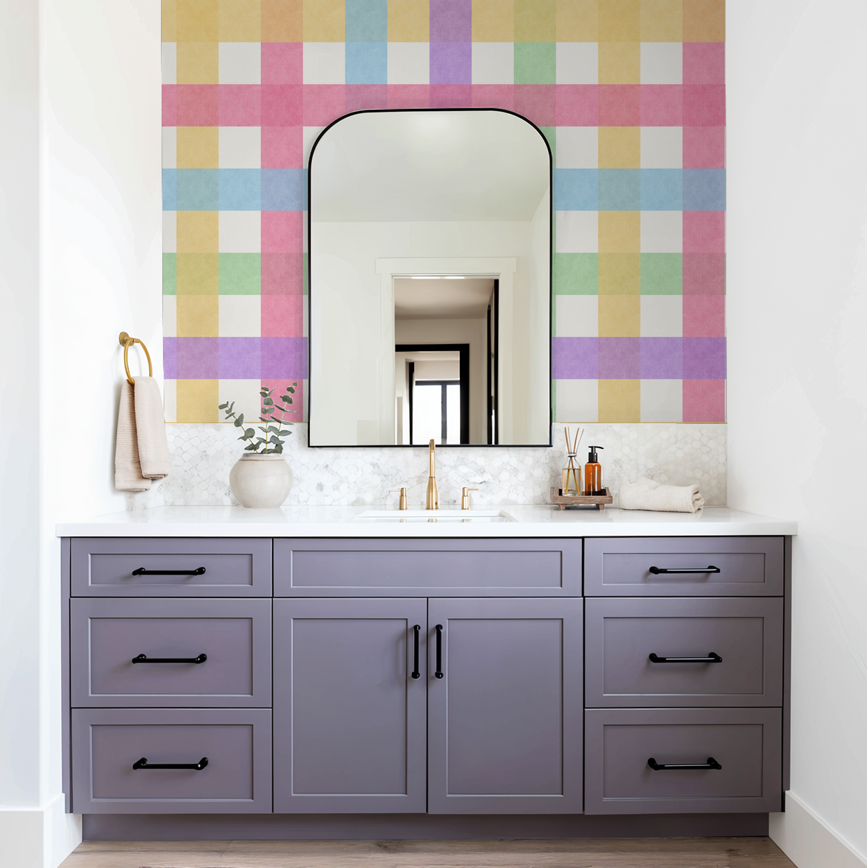 Bathroom with pastel gingham wallpaper, purple vanity, and gold fixtures.