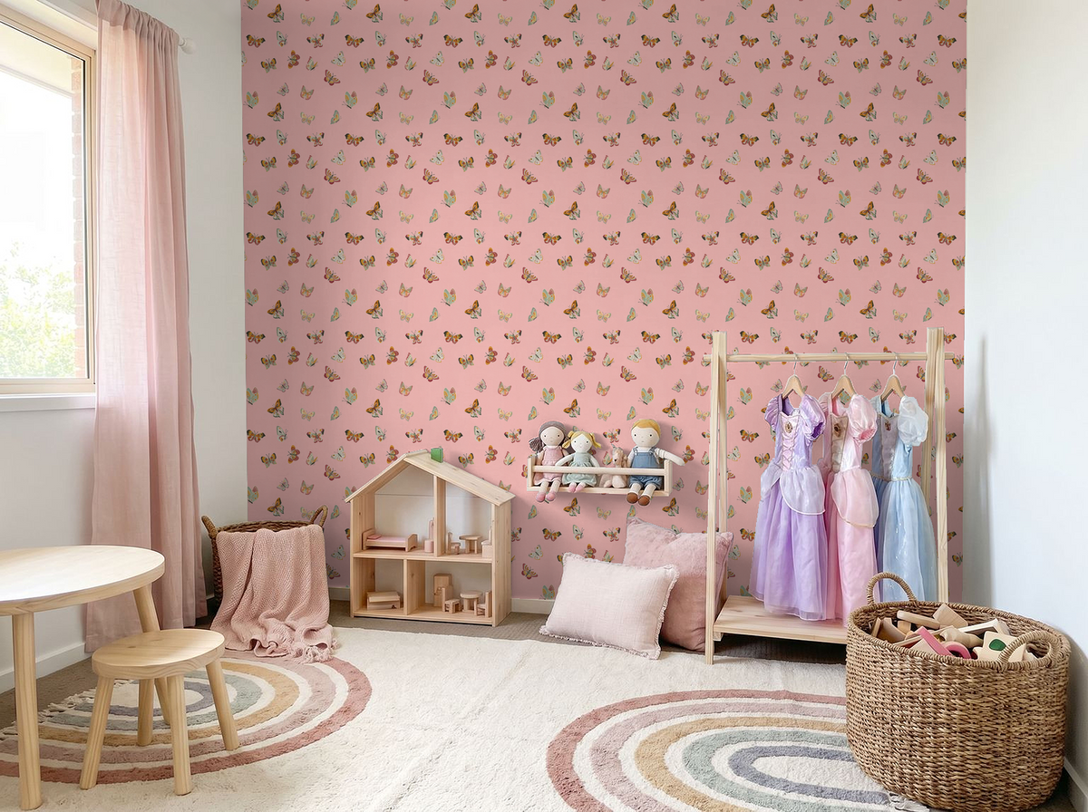 Pink butterfly wallpaper in a whimsical kid's playroom with pastel decor.