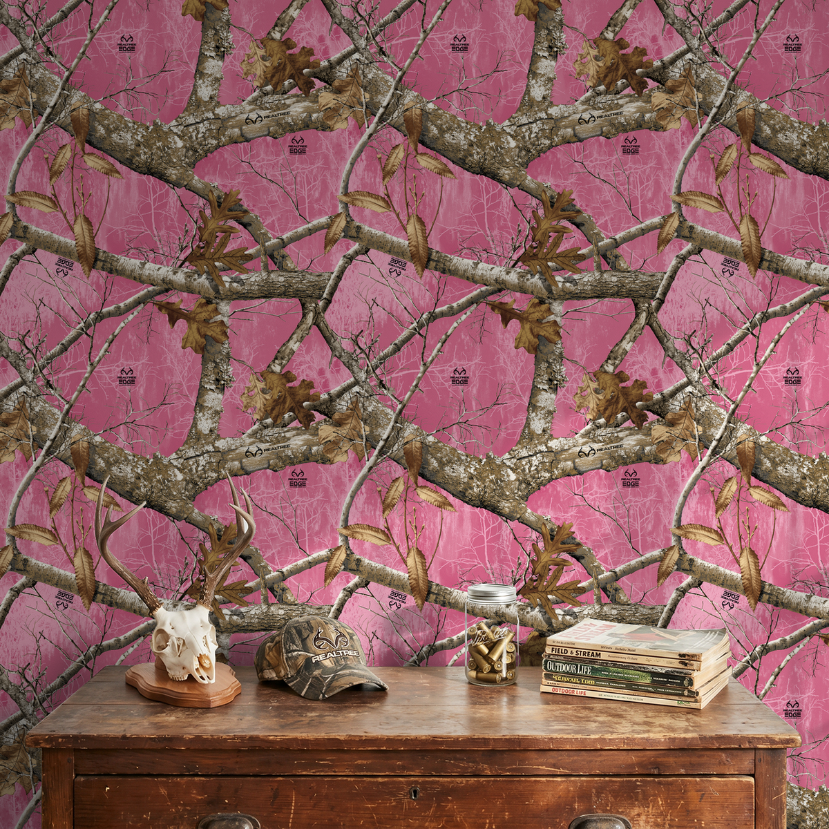 Rustic pink camo wallpaper with branches and leaves in a cozy setting.