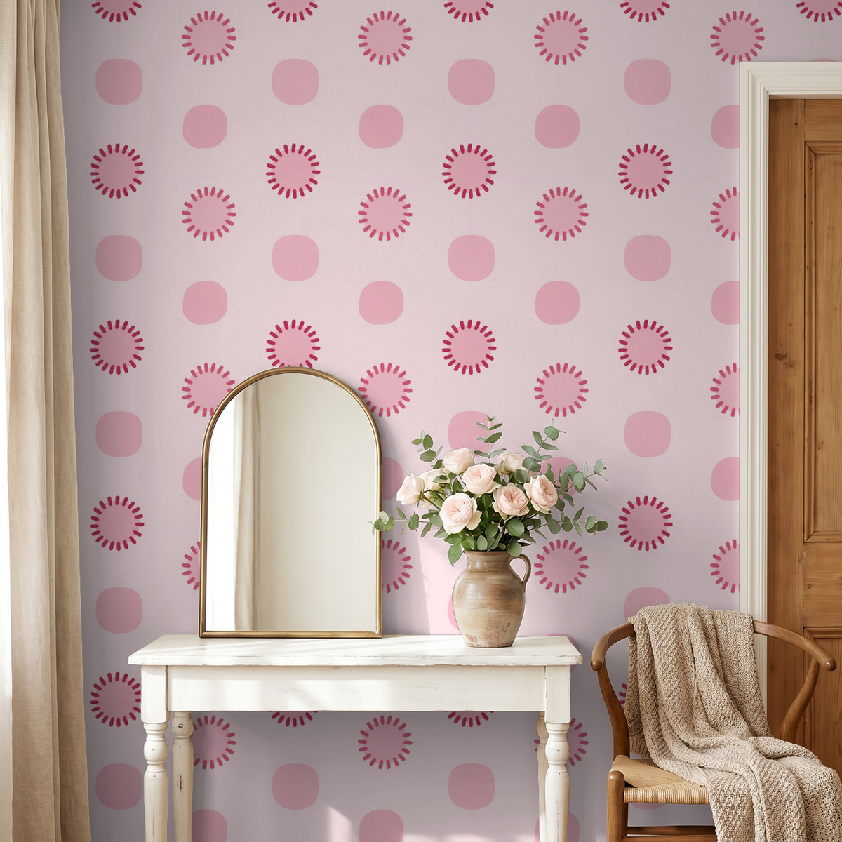 Pink circle dot wallpaper in elegant room with mirror and flowers.