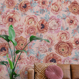 Blush Garden Wallpaper by The Nida Jahain Line in a cozy living room, highlighting floral patterns.
