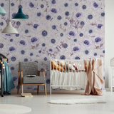 Fleur Blanche Wallpaper by The Nida Jahain Line showcased in a stylish nursery, highlighting its floral elegance.
