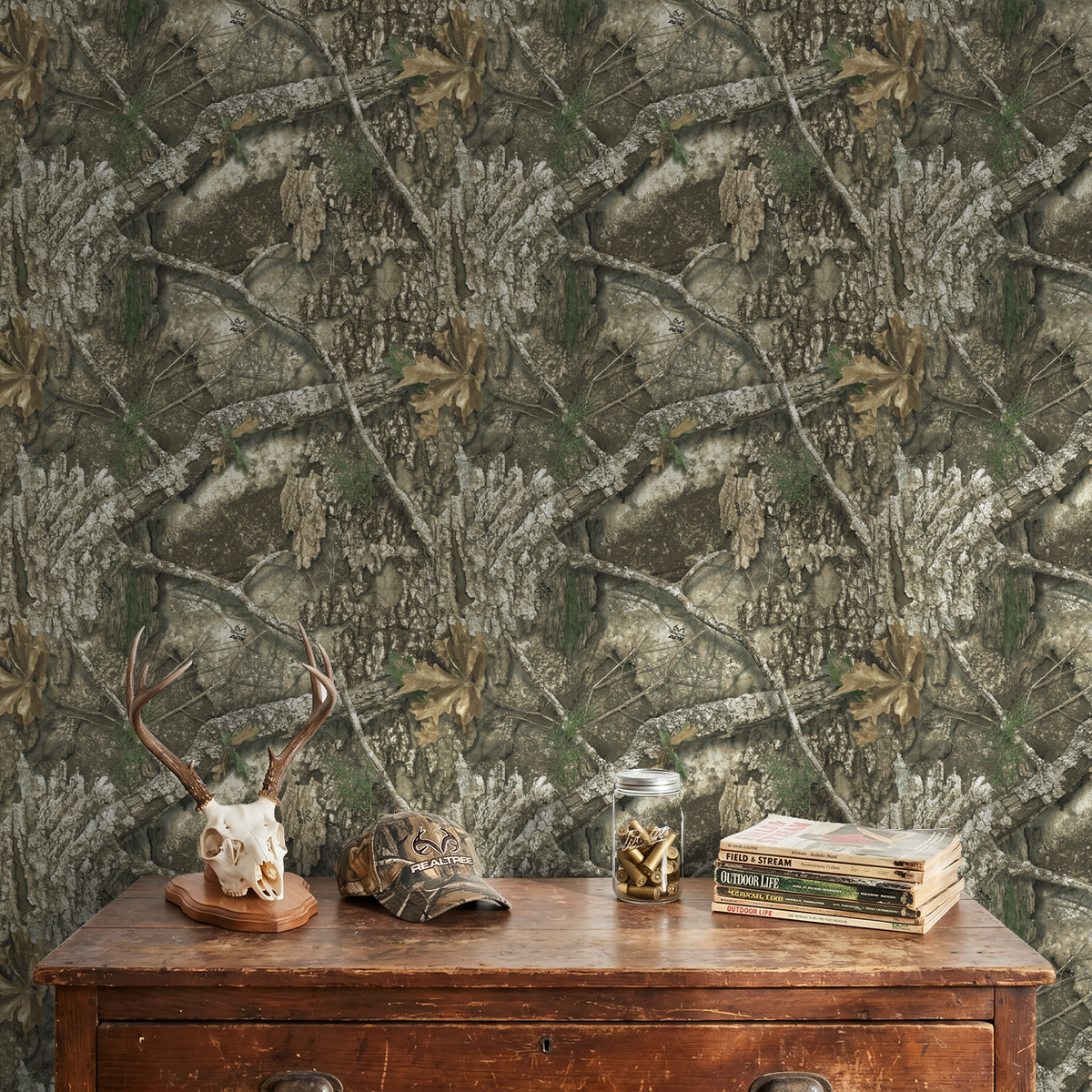 Realtree APX wallpaper with bark and leaves in rustic room setting.