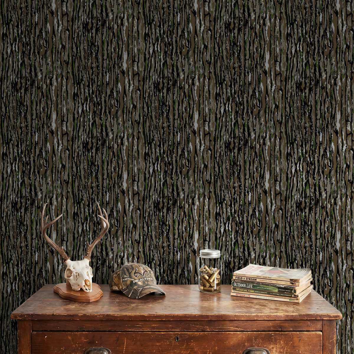 Realtree Original bark-pattern wallpaper in rustic room with antler decor.