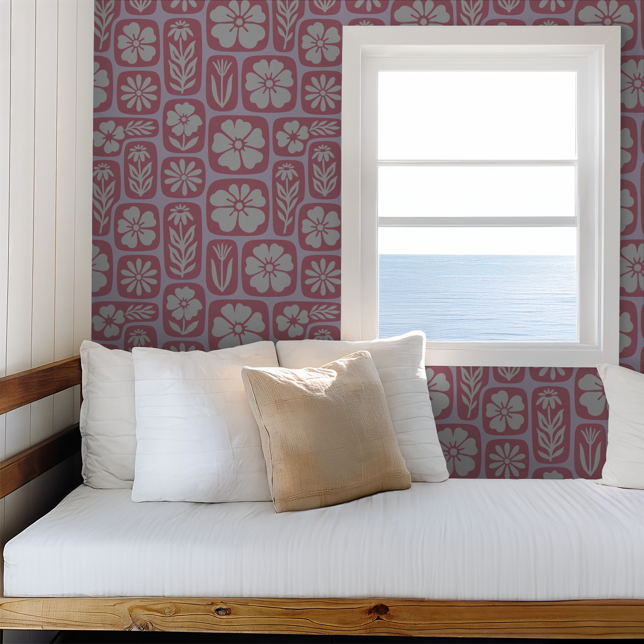 Retro floral pink and white wallpaper in cozy room with ocean view.