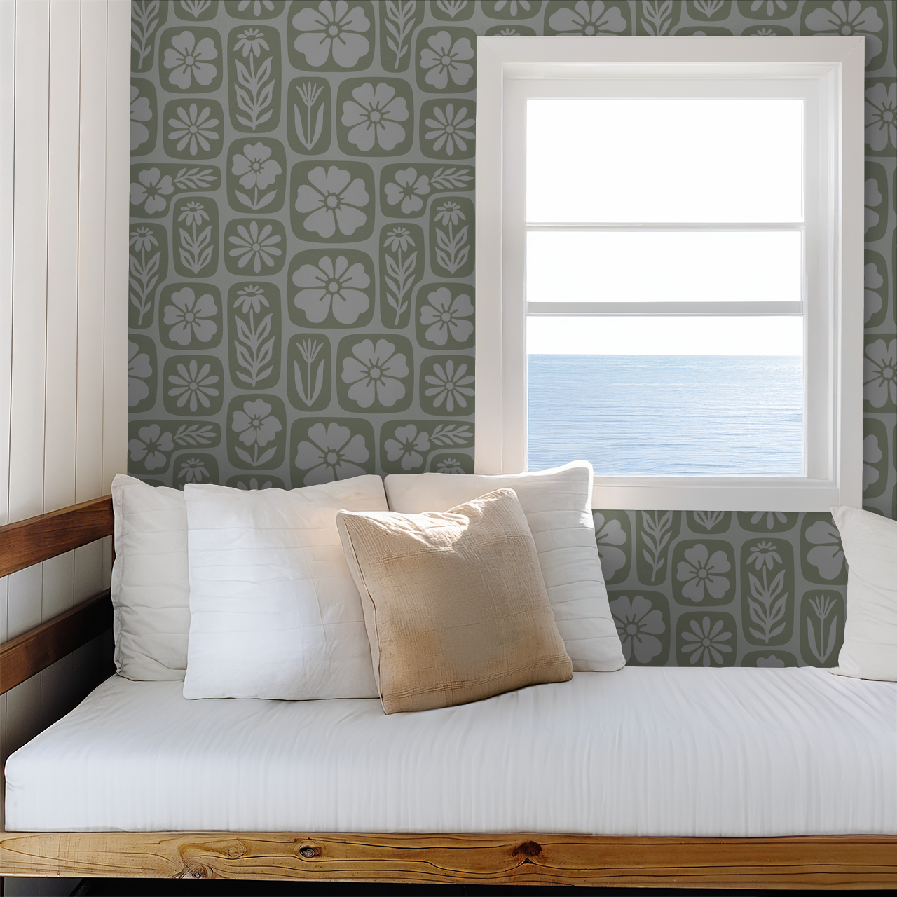 Sage floral wallpaper with botanical motifs in a cozy room by the sea.