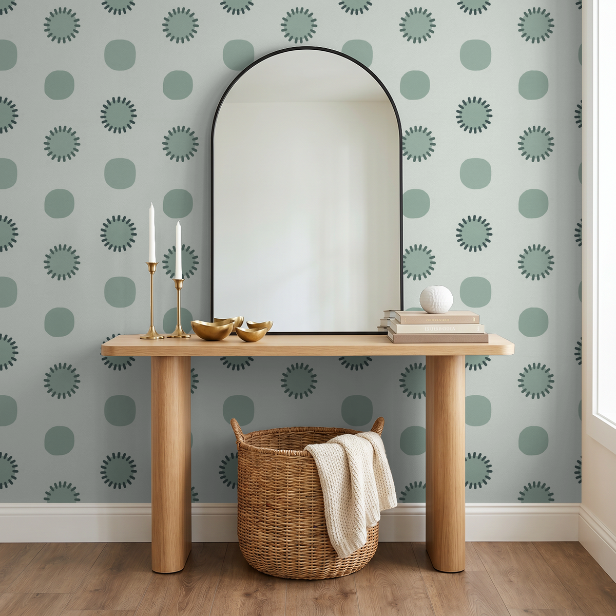 Sage geometric wallpaper with charcoal circles in modern room with mirror and wooden table.