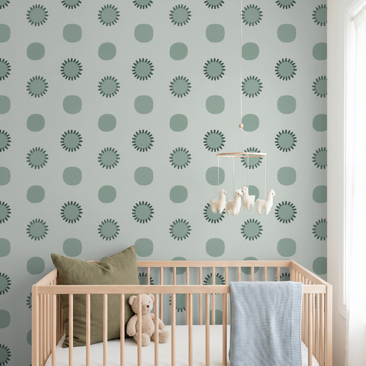 Sage green and charcoal circle wallpaper in a modern nursery with crib.