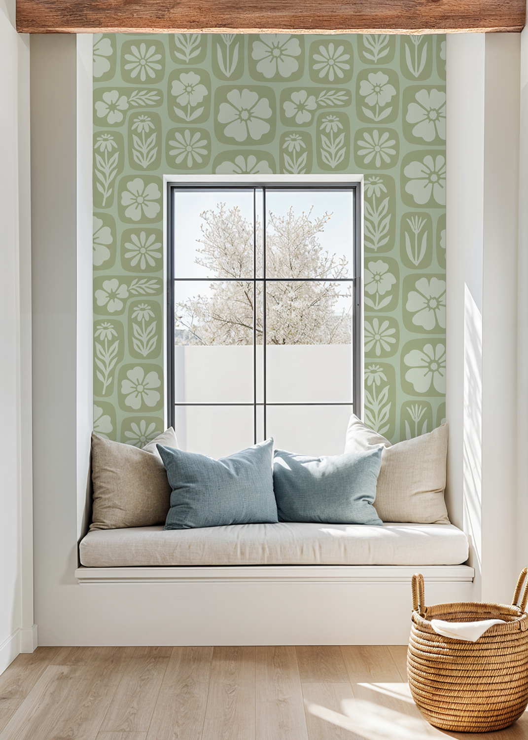 Sage green floral wallpaper in cozy nook with cushions and window view